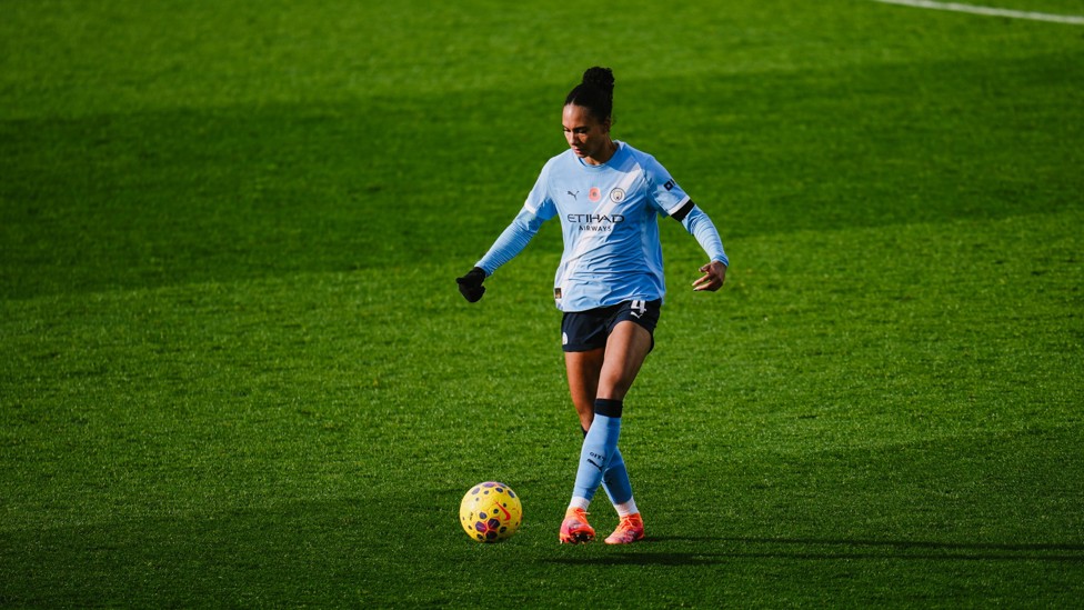 SOLID IN DEFENCE: Jade Rose drives forward with the ball