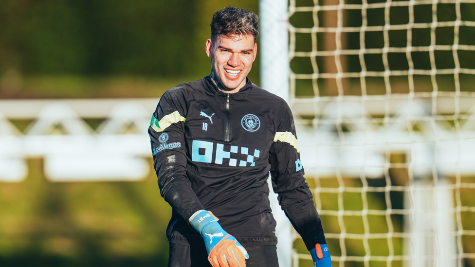 CHEESY GRIN : A muddy Ederson smiles for the camera