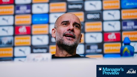 Blurred face in front of press conference backdrop with logos including Puma and betway. Text with 'Manager's Preview' and 'SUPER DRY Asahi'.