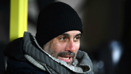 KEEPING WARM: Pep wraps up on a chilly night at the Pirelli Stadium