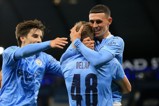 Phil Foden and Adrian Bernabe congratulate Delap