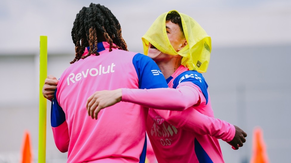 VEST IN THE BUSINESS : Phil Foden gets a hug from Jeremy Doku