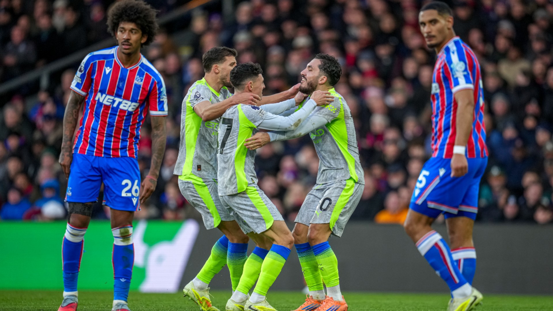 GET IN: The celebrations start after Phil Foden's strike.
