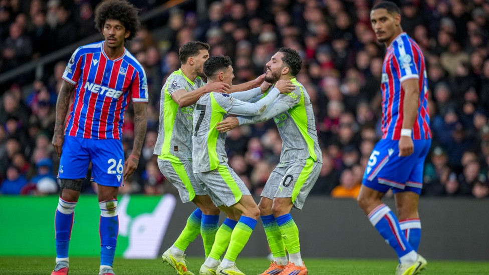 GET IN: The celebrations start after Phil Foden's strike.