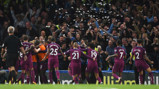 PAPER CHASE: The City players celebrate in front of the travelling fans
