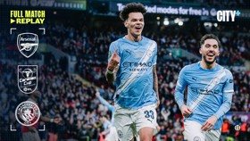 Manchester City players celebrating during a match, with Arsenal and Carabao Cup logos displayed. The text 'Full Match Replay' and 'City+' are visible.