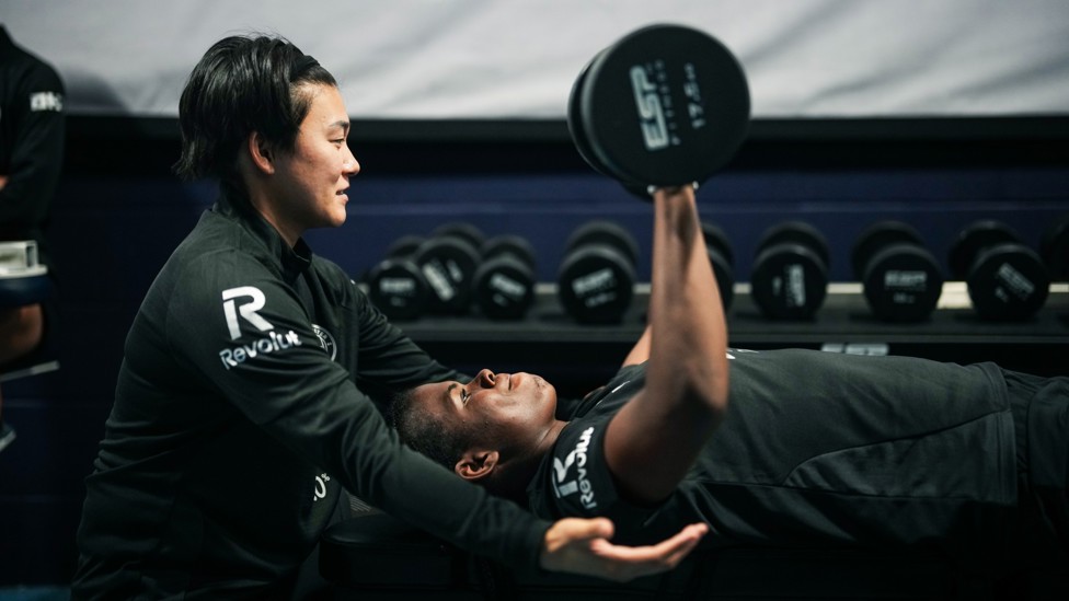 TEAMWORK: Ayaka Yamashita spots 'Bunny' Shaw during a weights session