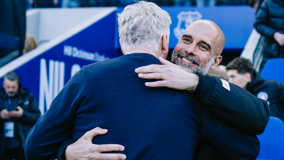 BOSSES : Pep and Moyes share a warm embrace ahead of kick-off.