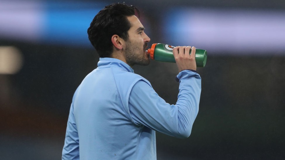 GUNDO-GULP : Ilkay gets the last of his refreshments downed ahead of kick off.