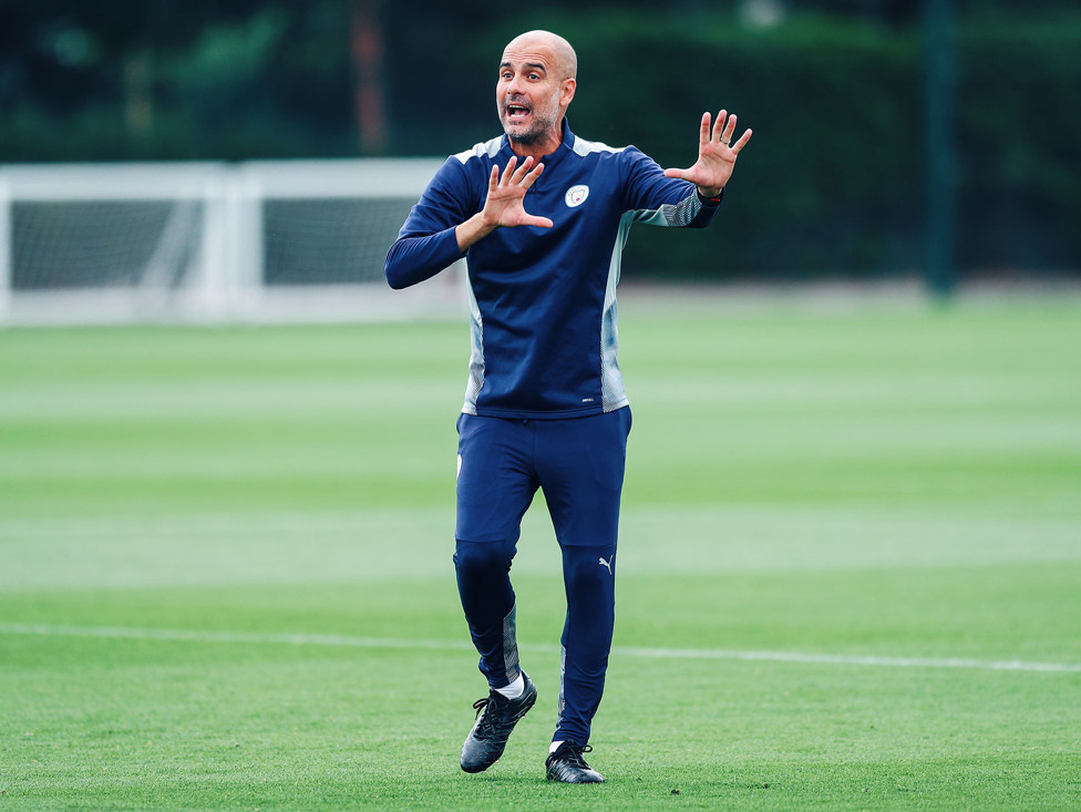 THE BOSS: Pep Guardiola gets his point across to the City players