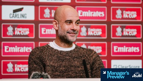 Press conference backdrop featuring Emirates FA Cup logos and Carling logo, with 'Manager's Preview' overlay.