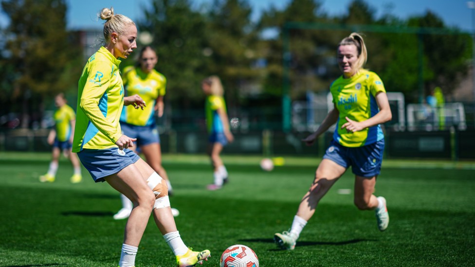 ON THE BALL : Alex Greenwood switches the play