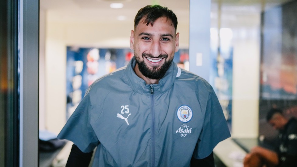 WINNER WINNER: Gianluigi Donnarumma with a beaming smile on his way to training 