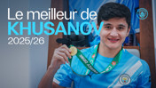 A Manchester City player wearing a club jersey is holding a medal with a green ribbon. The image text reads 'Le meilleur de Khusanov 2025/26' and features the Manchester City logo.