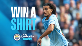 Promotional image featuring a Manchester City player in motion, with text 'Win a Shirt' and the Manchester City and City in the Community logos.