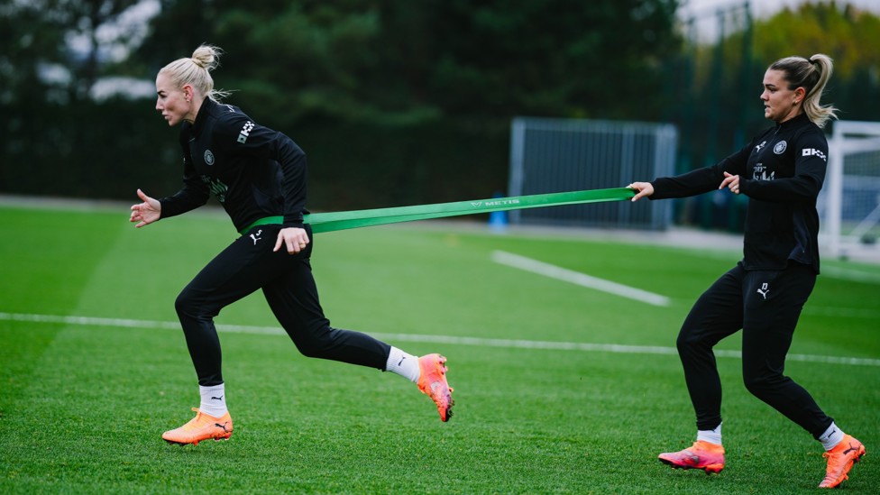 COME BACK HERE : Alex Greenwood sprints against the resistance band