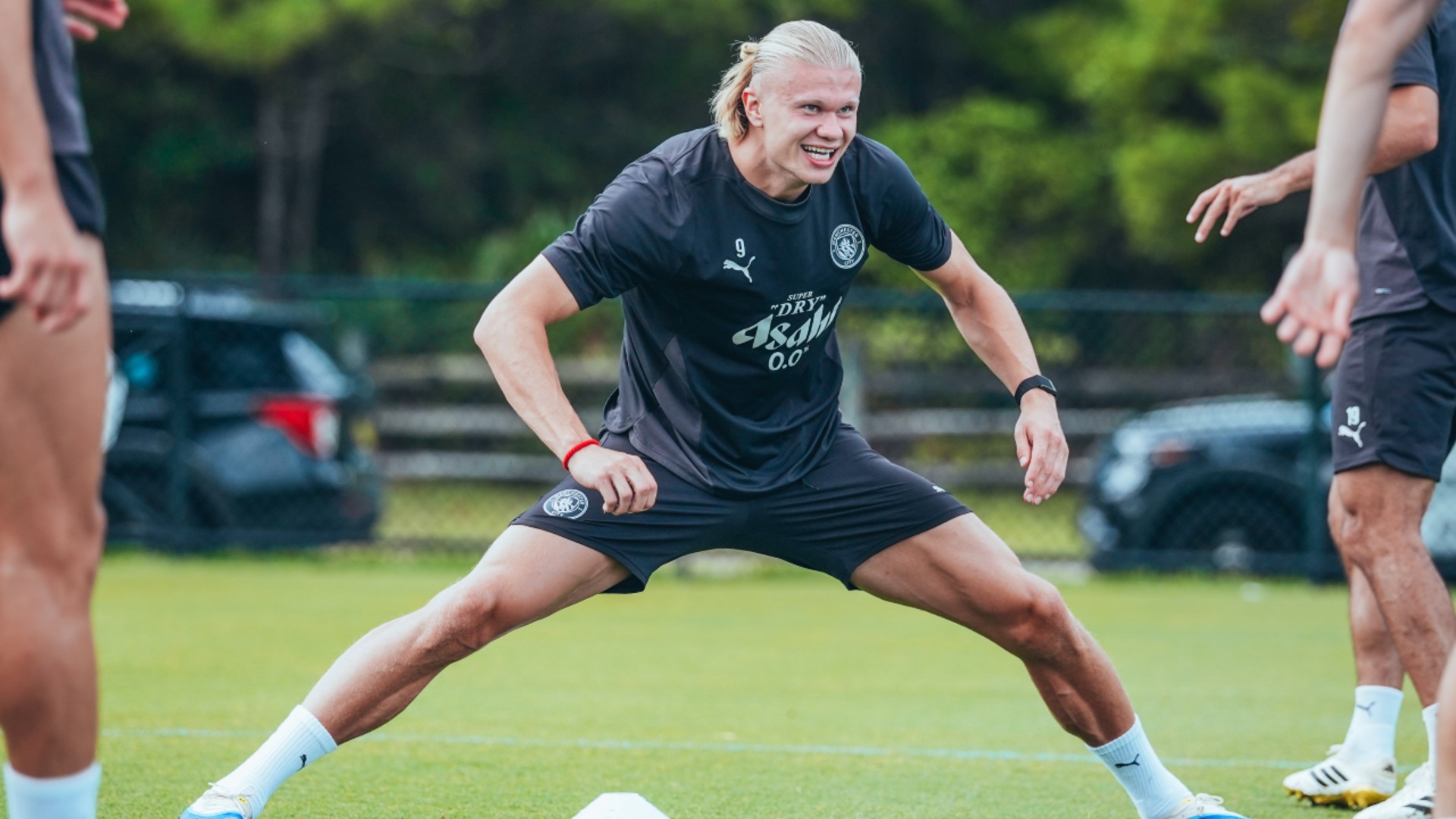 FORWARD MARCH: Erling Haaland gets stuck into a stretching exercise .