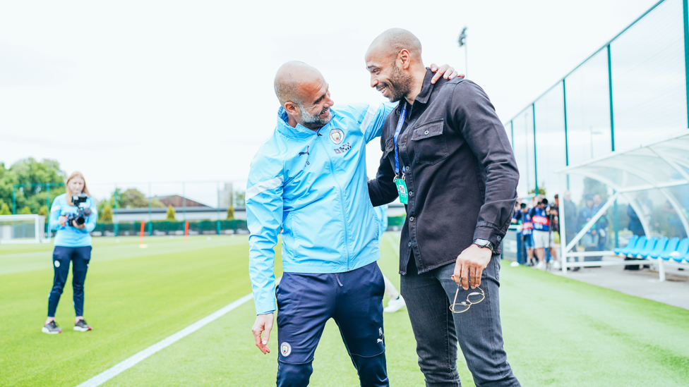 WHAT A DUO : Pep Guardiola and Thierry Henry enjoy a quick reunion at the CFA.
