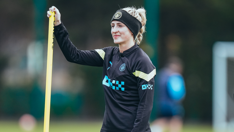 MIDFIELD GENERAL : Laura Coombs looks on during the session