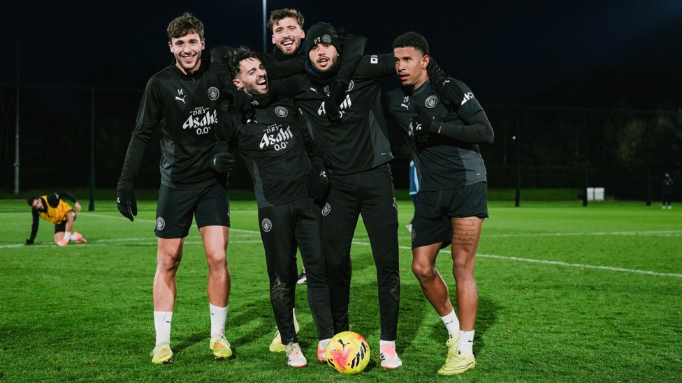 FAMOUS FIVE : City players celebrate