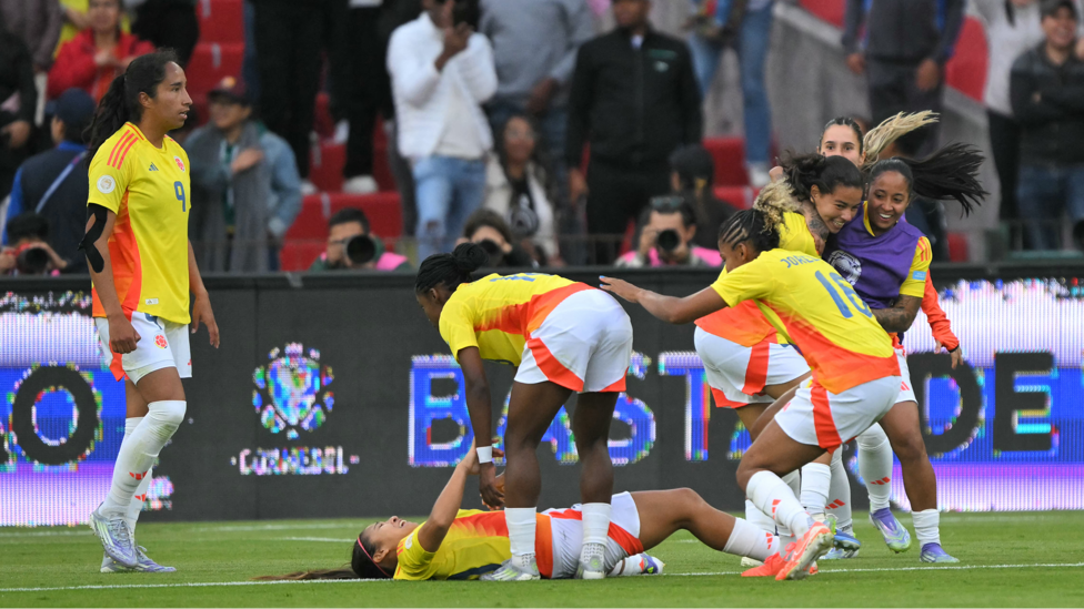 AHEAD AGAIN: Colombian players celebrate after Brazil scored an own goal