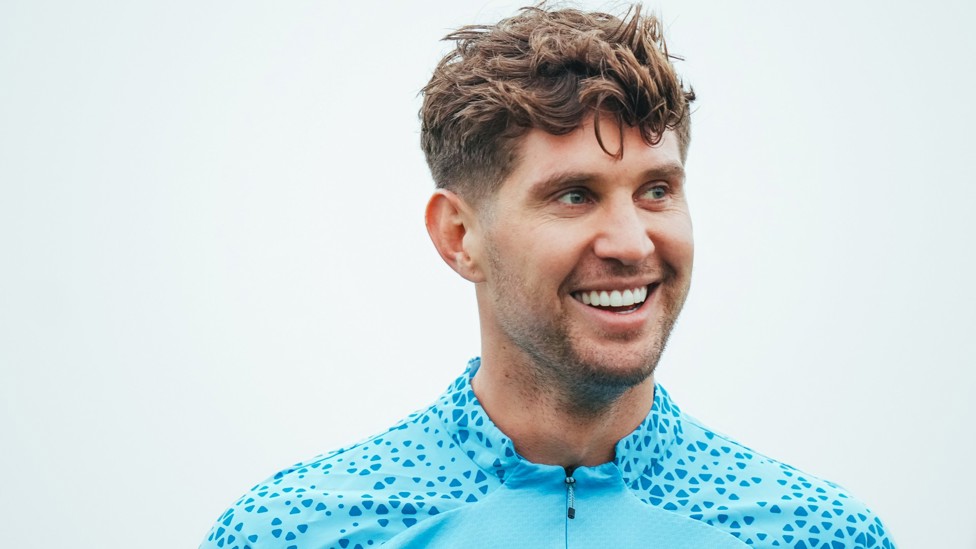 STONE COLD : John Stones looks happy