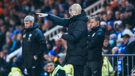 PEP TALK: The boss passes on some instructions from the touchline.