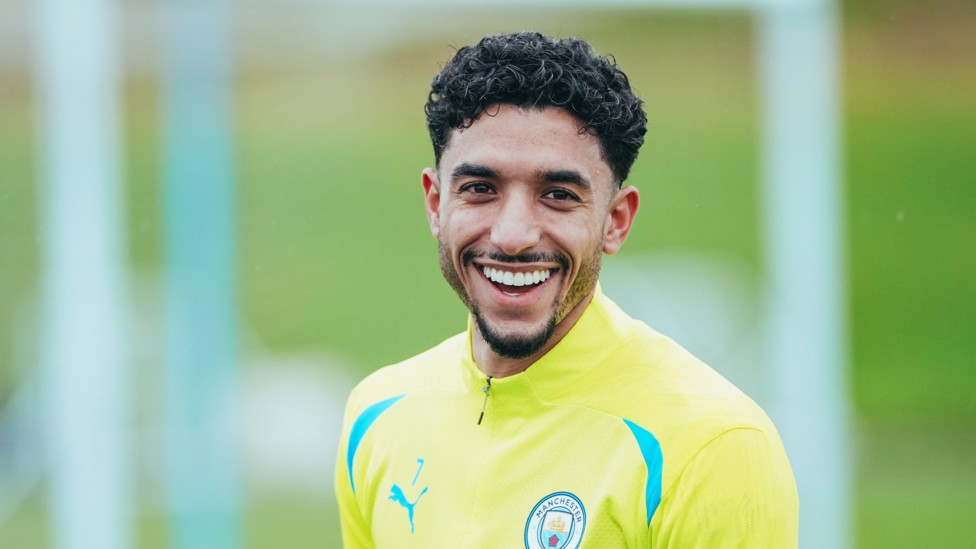 ALL SMILES : Omar Marmoush gets used to the Manchester rain