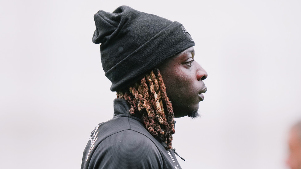 HAT'S THE WAY TO DO IT : Jeremy Doku keeps warm