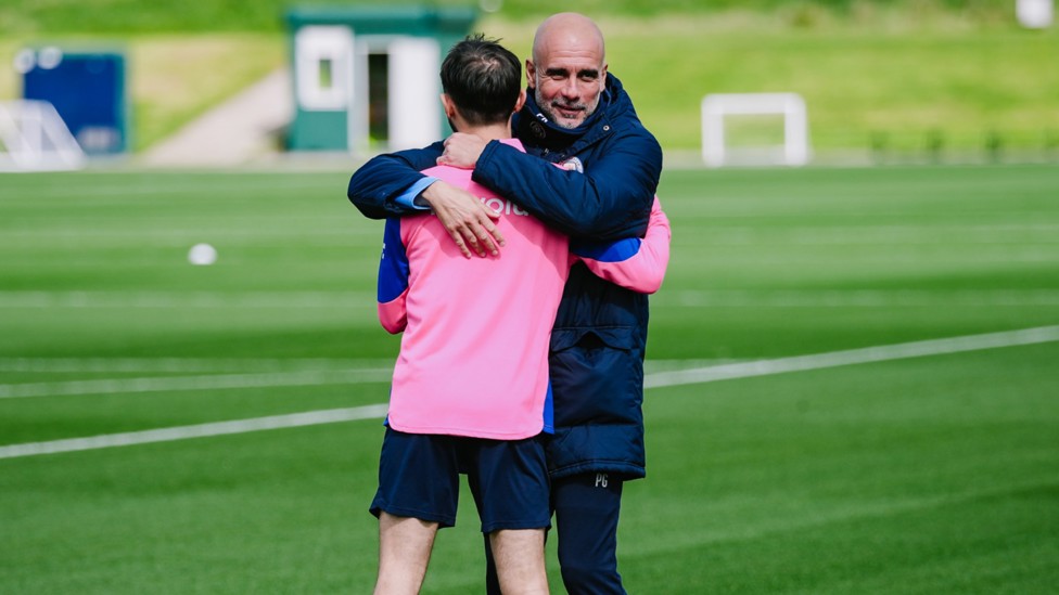 WARM EMBRACE : Pep Guardiola and Bernardo Silva greet each other. 