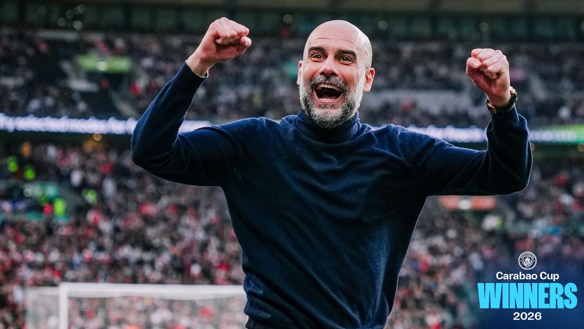 A person in a stadium celebrating with clenched fists. Text indicates Carabao Cup Winners 2026.