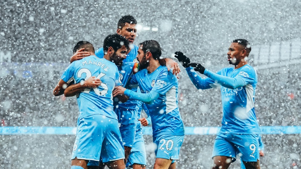 SNOWHERE TO GO : Gundogan is mobbed by Mahrez and co after his goal.