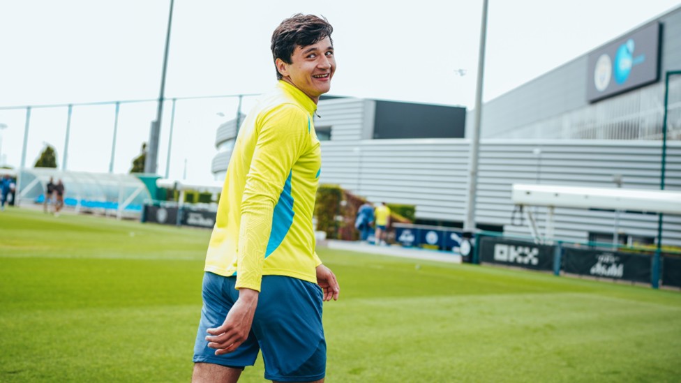ALL SMILES: Abdukodir Khusanov was in great spirits as he went about his work.