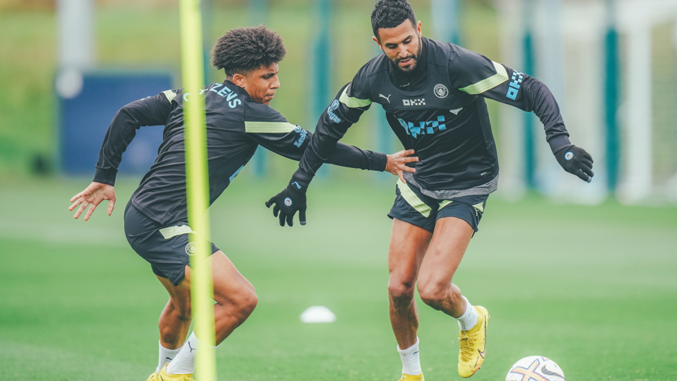 STEPPING UP : Rico Lewis battles for possession with Riyad Mahrez