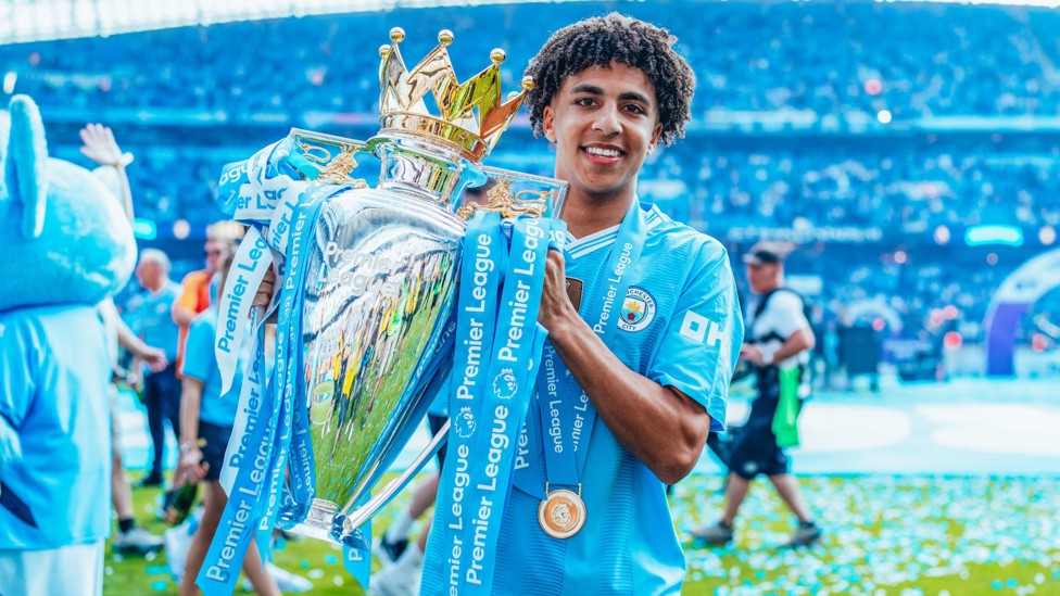 BEST IN ENGLAND : Rico Lewis with the 2023/24 Premier League trophy. 