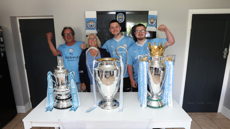 Official Supporters Club members surprised with Treble trophies 