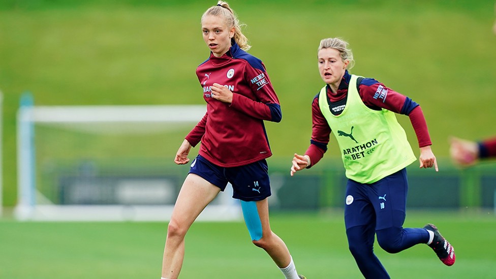 WATCH OUT : White creeps up behind Morgan to try and pinch the ball!