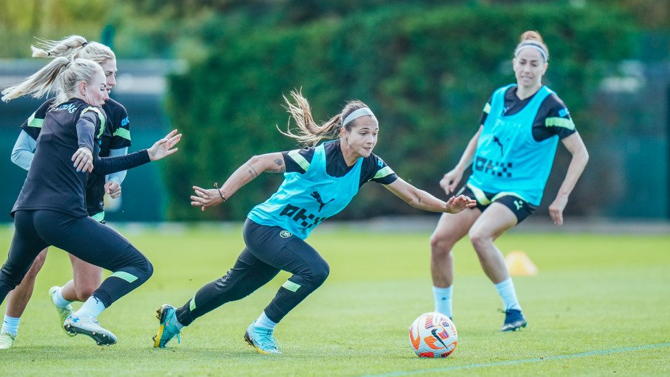 FIGHTING FOR THE BALL : Deyna maintains possession in a busy area