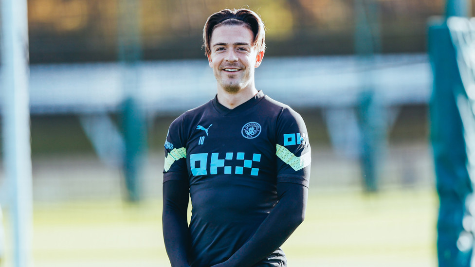 HAPPY GREALISH : Jack Grealish watches on 