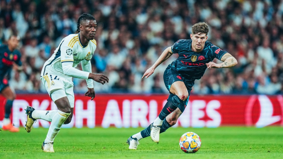 TOUCH TIGHT : John Stones keeps tabs on Vinicius Junior