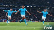 Players in Manchester City jerseys celebrating a goal on the soccer field during a UEFA Champions League match. Text reads 'Thank you Rodri'.