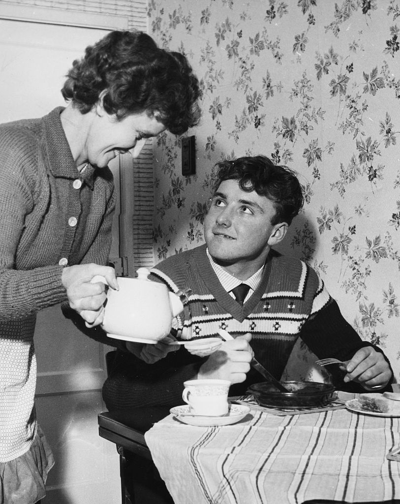 MOTHER'S PRIDE: A 15-year-old Glyn Pardoe gets a cup of tea from his Mum the morning after his City debut