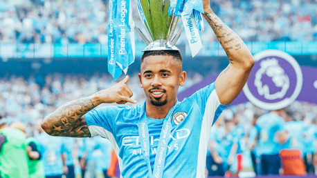 PRAYERS ANSWERED: Jesus poses with the trophy.
