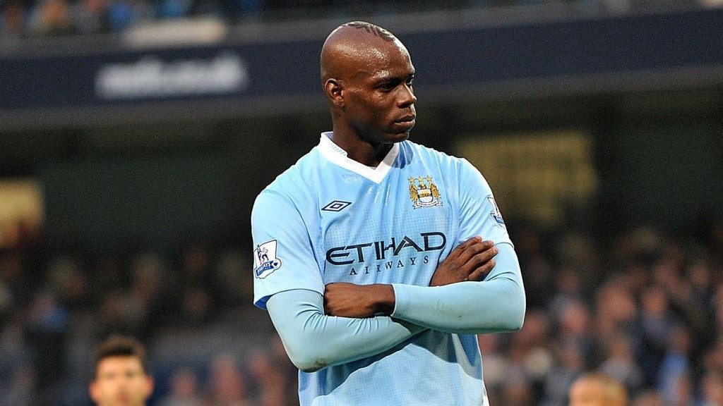 SUPER MARIO  : Mario Balotelli celebrates the opening penalty in trademark fashion