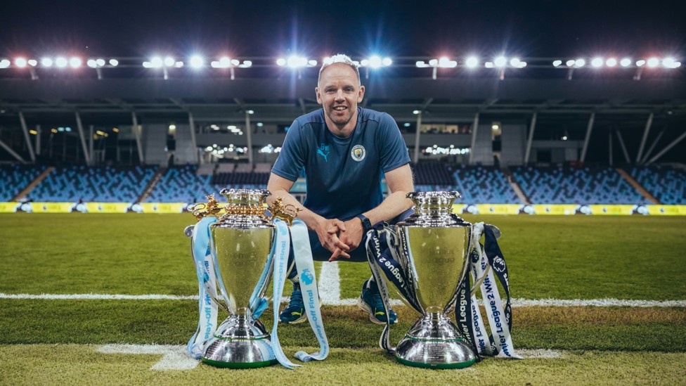 THE BOSS : Ben Wilkinson with our two trophies from 2024/25. 