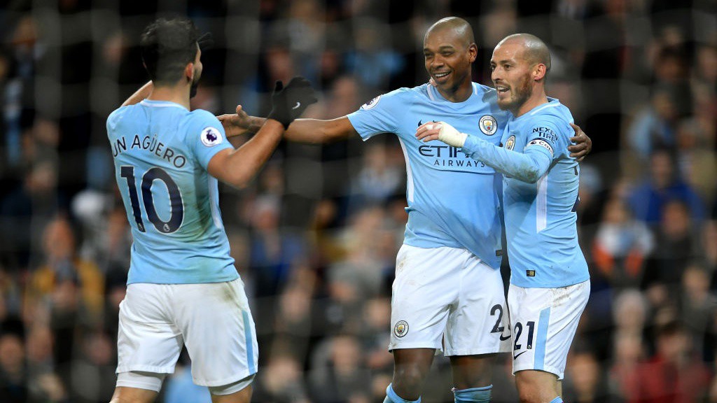 MIDFIELD MAESTRO : City celebrate Fernandinho's coolly-taken finish against West Brom -our 100th goal last term