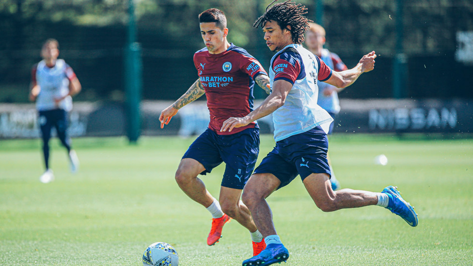 DEFENSIVE DUO: Nathan Ake and Joao Cancelo challenge for the ball
