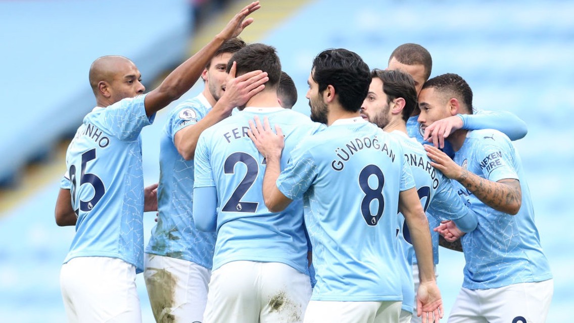 SQUAD GOALS: The team gather to celebrate the opening goal.
