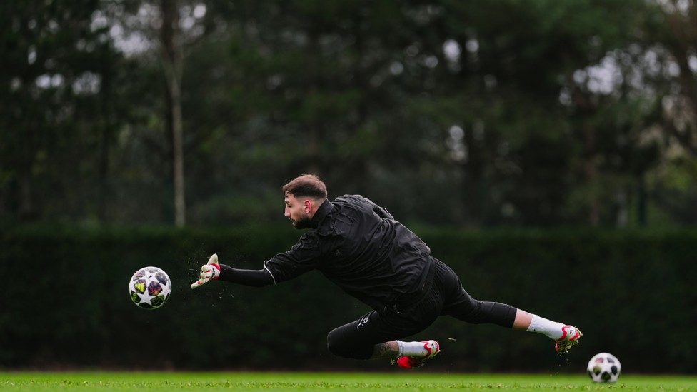 FULL STRETCH : Gianluigi Donnarumma dives for the ball
