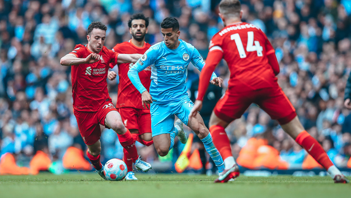 WOW JOAO: Cancelo weaves away from Jota's challenge.